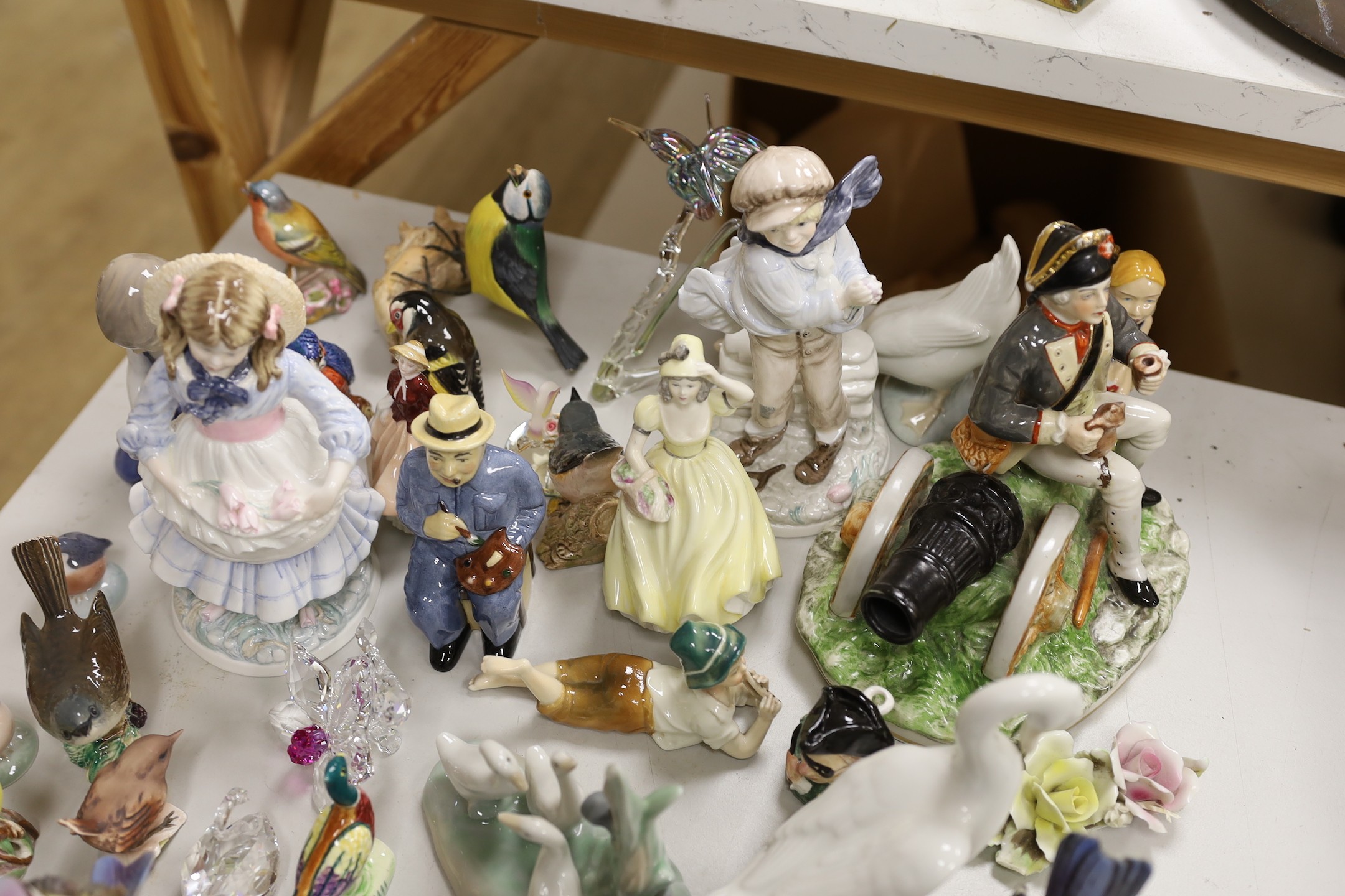 A Royal Copenhagen figure and a collection of Nao ducks, Beswick, Doulton and other birds